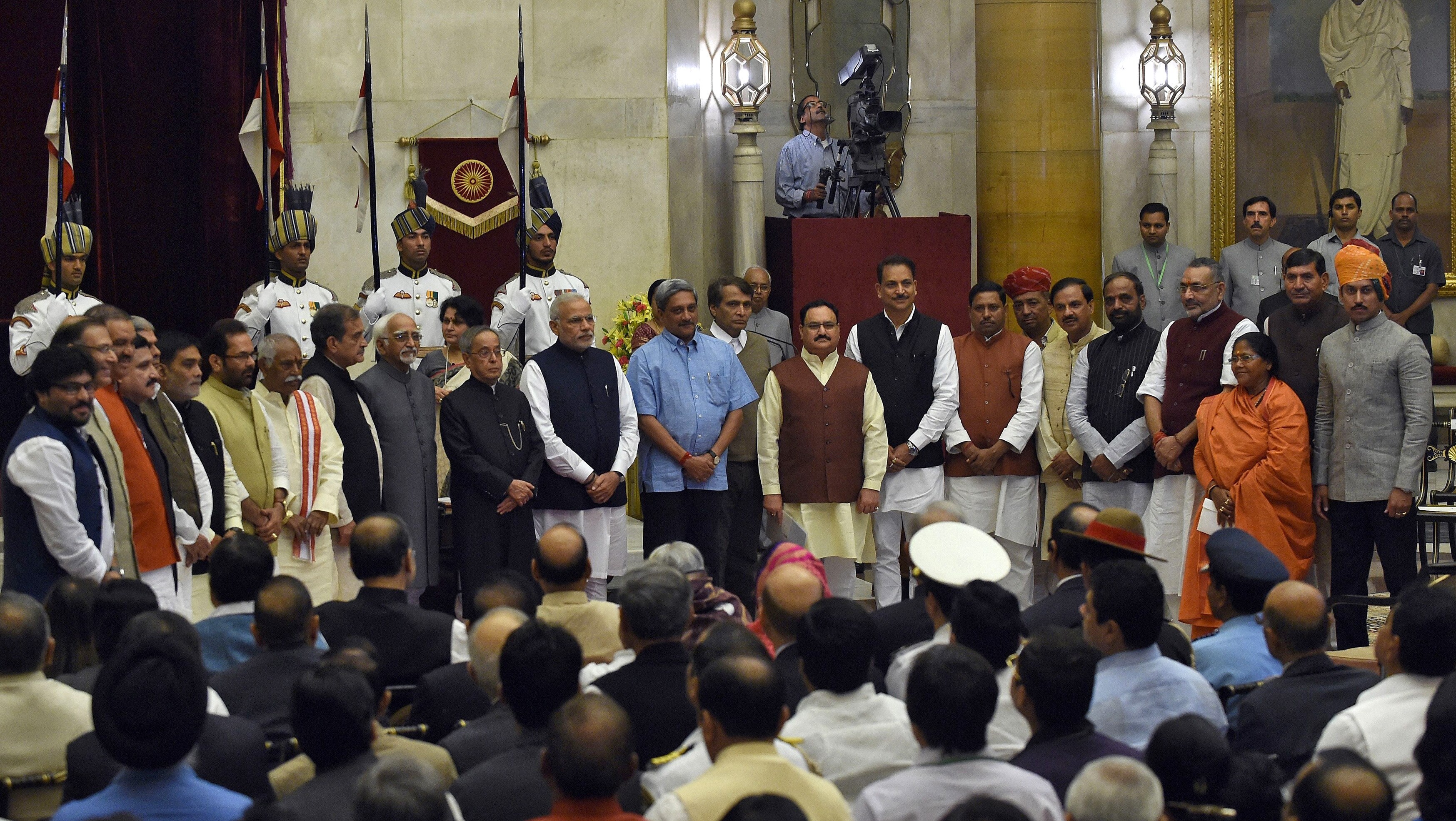 Prime Minister Narendra Modi poses with cabinet ministers after the swearing-in ceremony at the presidential palace in New Delhi, November 2014. (Photo: Reuters)